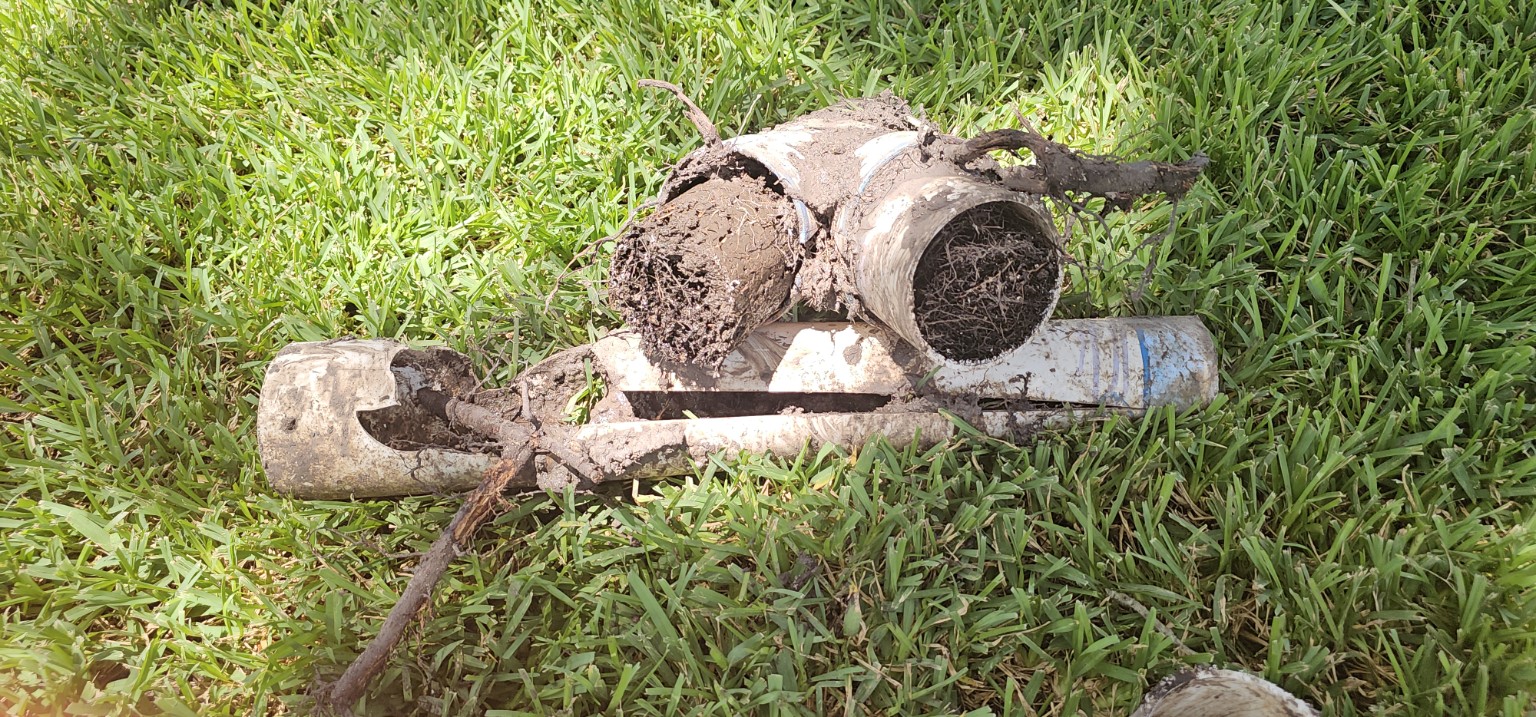 Root intrusion removed from a damaged yard drainage fitting